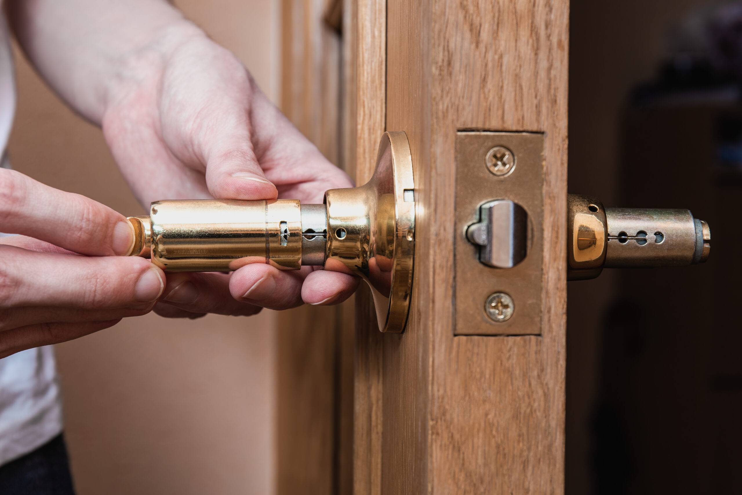 locksmith carpenter fix knob on wooden door by screwdriver for home service reparation